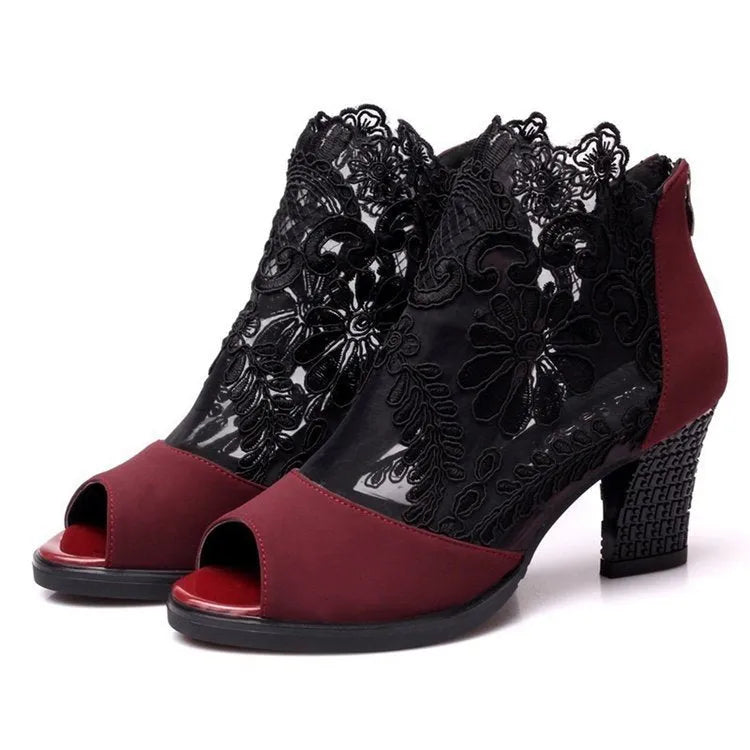 Black women's lace-up gladiator sandals with a square heel and zip fastener.