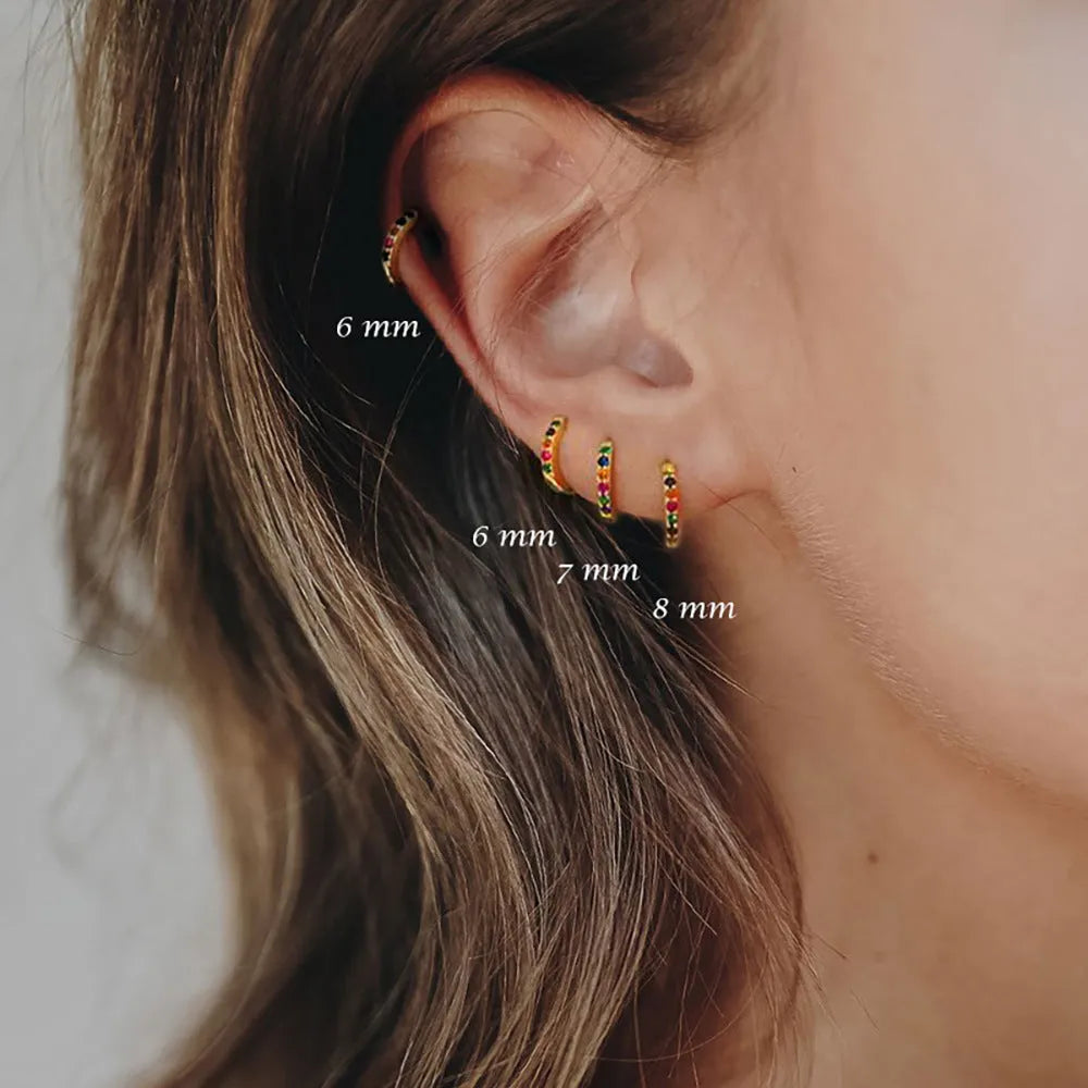 Round zircon perforated stud earrings in gold, rose gold, or silver colour with geometric design