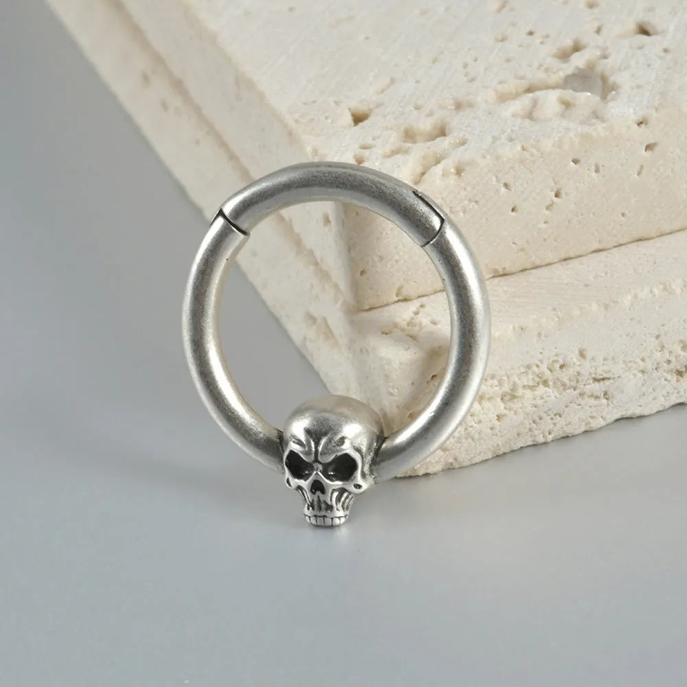 Copper punk-style earrings featuring a ghost head motif in antique silver or gold finish.
