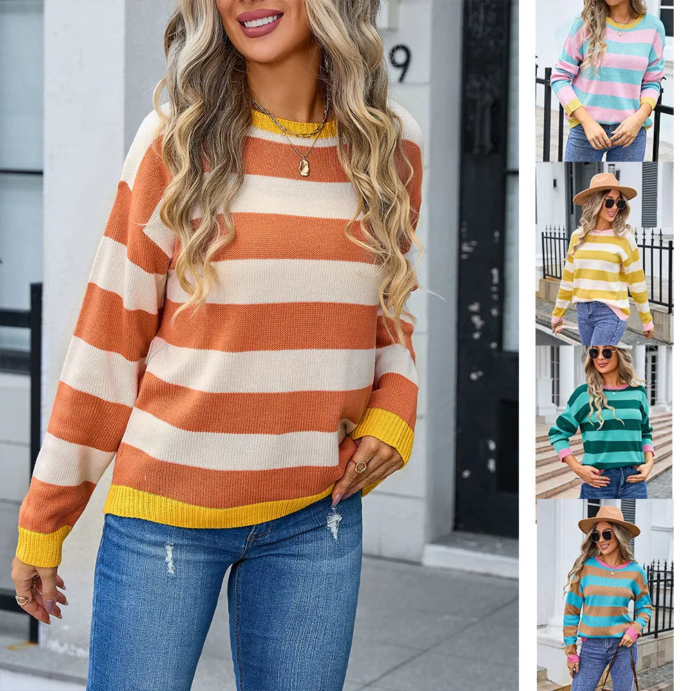 Women's loose fit long sleeve acrylic sweater in blue with a striped pattern, showing round neck.