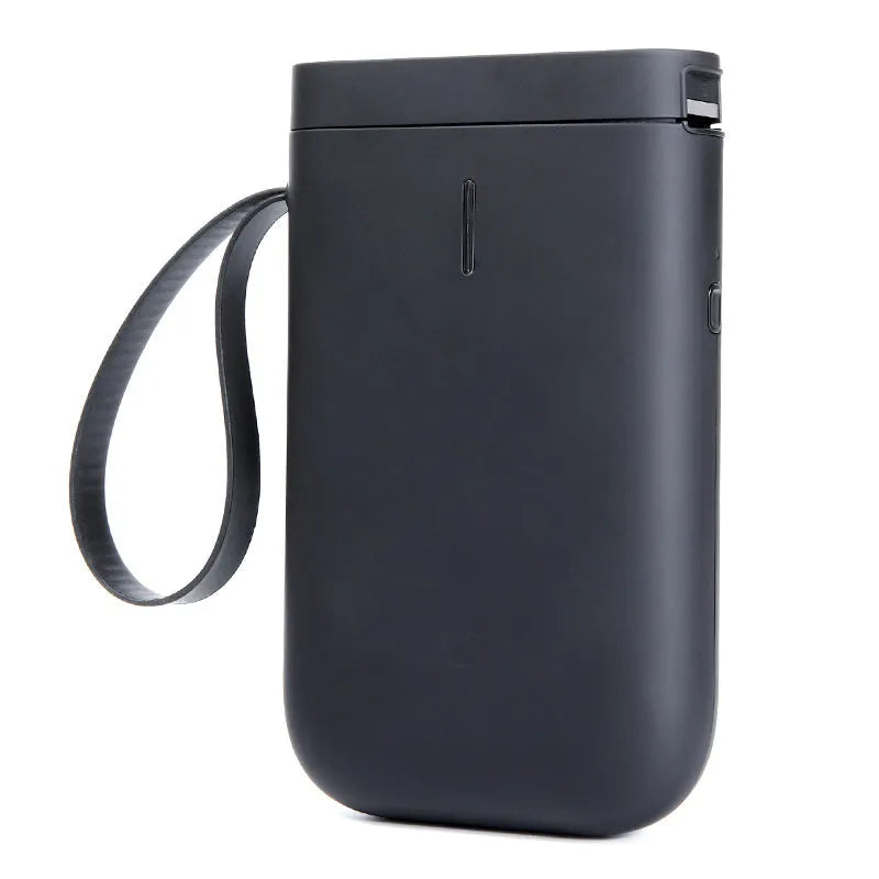 D11 compact black Bluetooth thermal label printer with LCD screen on a desk.