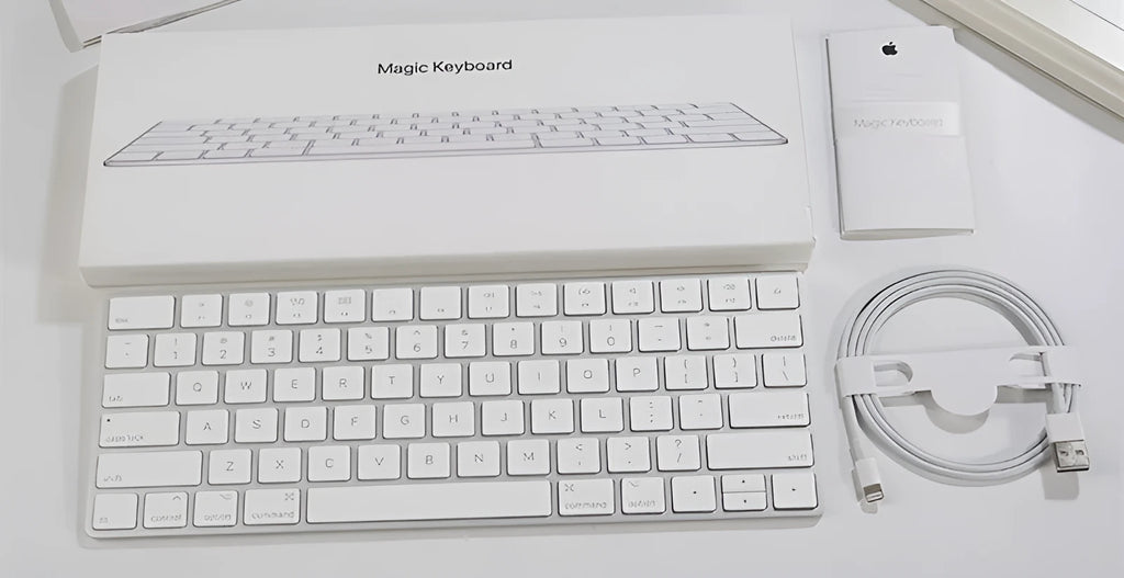 White Apple G6 ultra-thin aluminium Bluetooth wireless keyboard on a desk.
