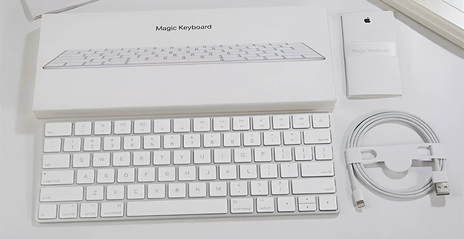 White Apple G6 ultra-thin aluminium Bluetooth wireless keyboard on a desk.