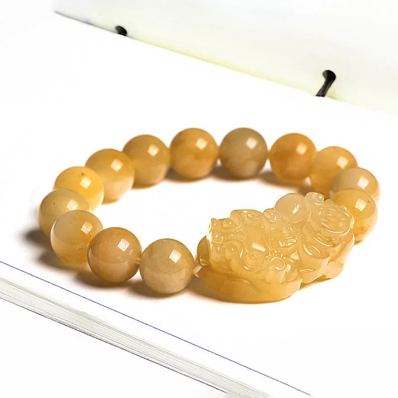 Golden Thread Jinsi Jade carved money bracelet showing pendant and beads, with size option examples.