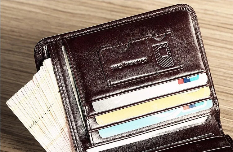 Men's leather wallet showing multiple internal compartments including card slots and change purse