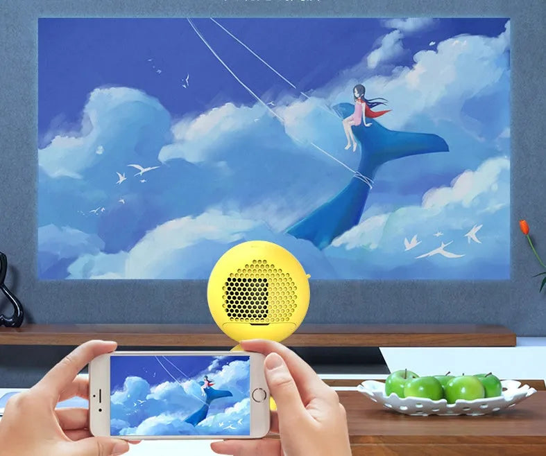 YG220 portable LED projector in white or yellow colour showing front projection lens.
