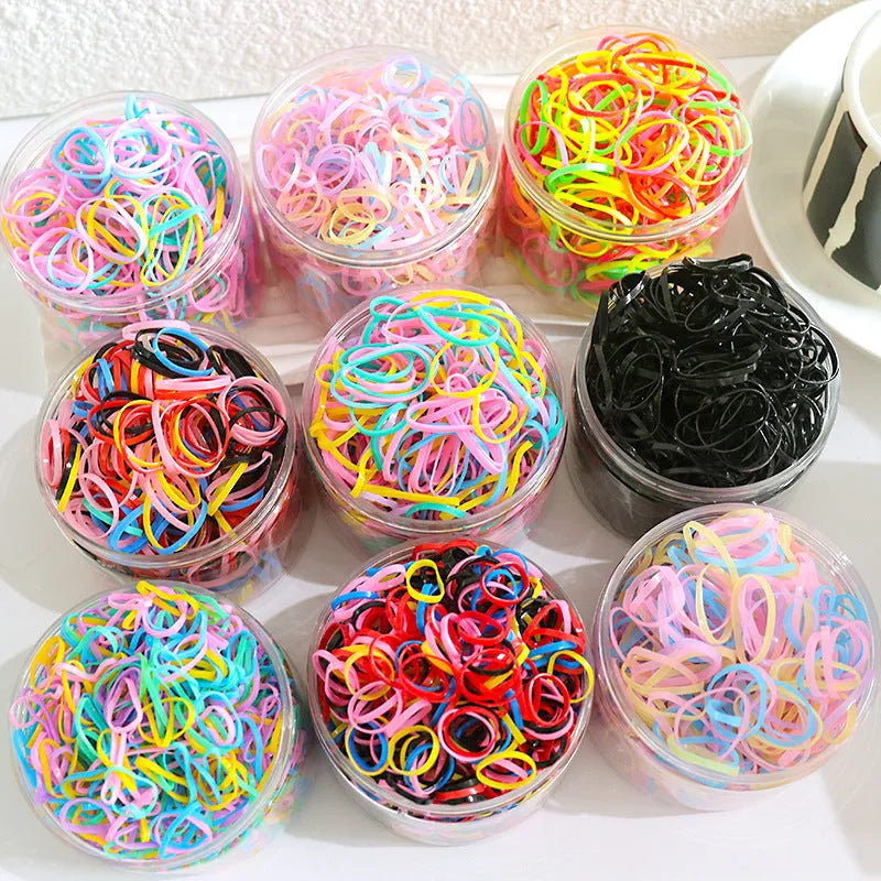 300 or 600 piece pack of baby hair ties in assorted colours, small TPU elastic bands for fine hair, supplied in a reusable container