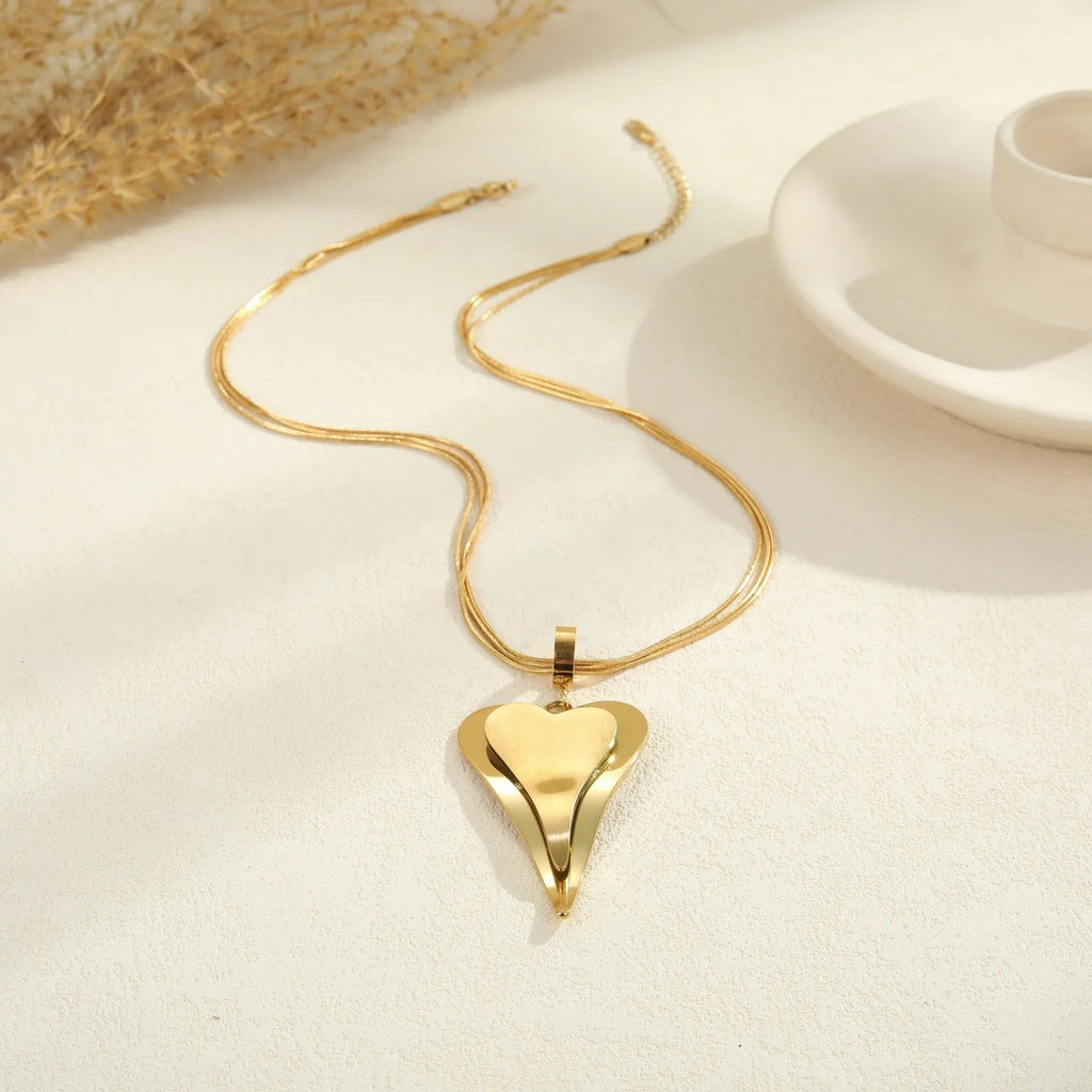 Women's geometric snake bones chain necklace with double heart design in gold or steel finish