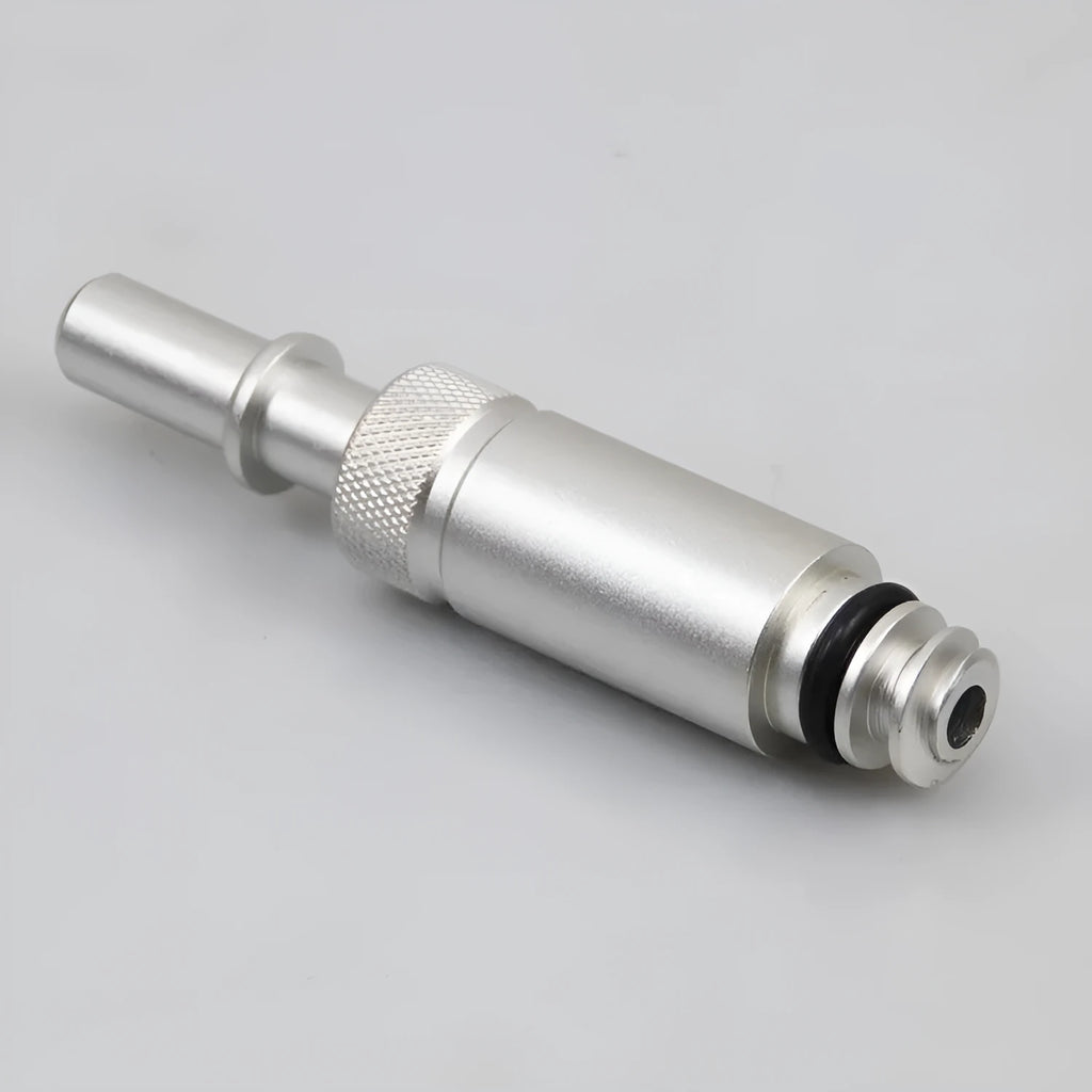 Silver VAS6262-9 metal transmission refueling joint adapter tool on a workshop bench.