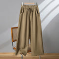 Women's straight-leg casual trousers with an elasticated drawstring waist in apricot colour