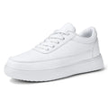 Women's white leather lace-up casual flat shoes on a solid background