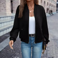 Black women's casual long sleeve zip jacket with faux pocket detailing on a model