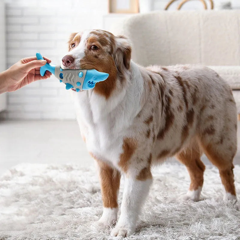 Dog teething leaky toy in blue with shark-tooth surface and treat cavity