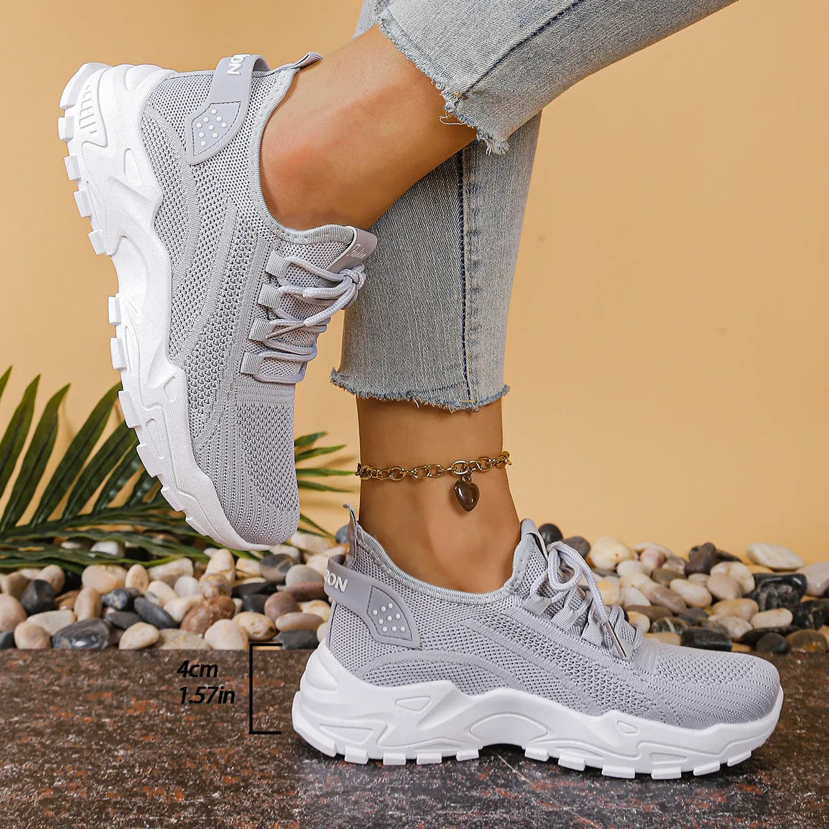 Women's low-top flyknit-style mesh casual trainers in various colours on a white background.