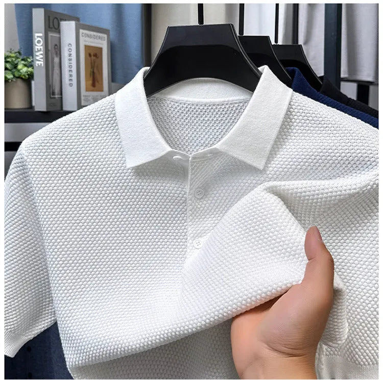 Man wearing a loose grey cotton short sleeve pullover sweater for casual leisure.