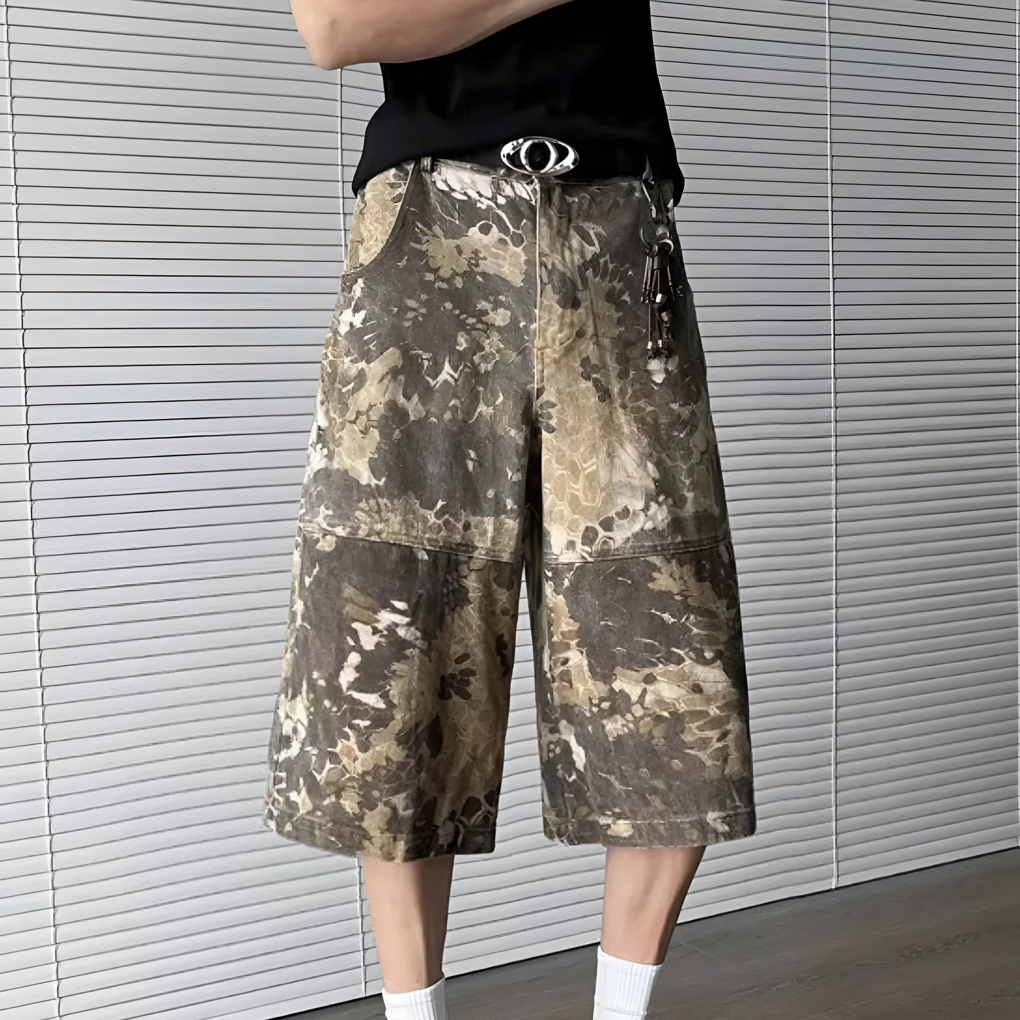 Yellow snake pattern camouflage cropped jeans showing detailed tooling print and denim construction