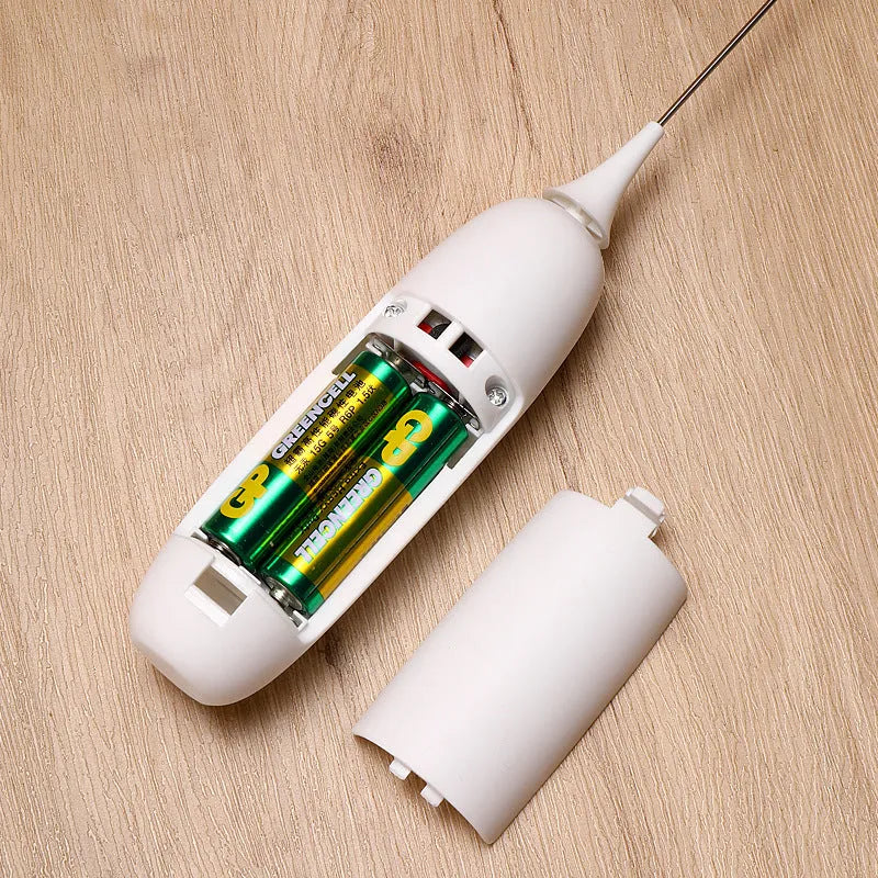 Black and white hand-held electric milk frother blender for coffee beverages