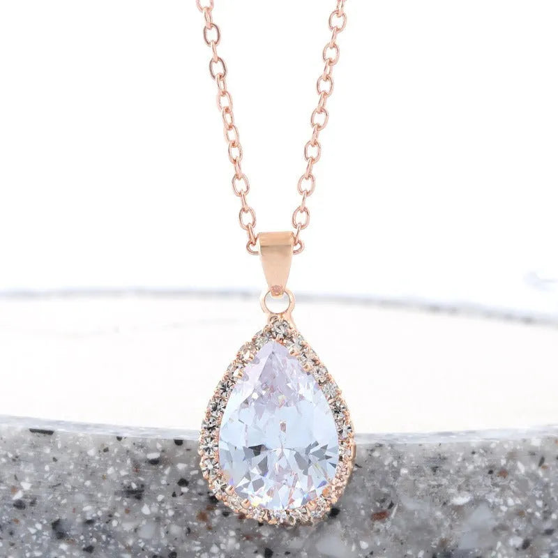 Women's rose gold drop shape necklace with rhinestone details on an alloy chain.