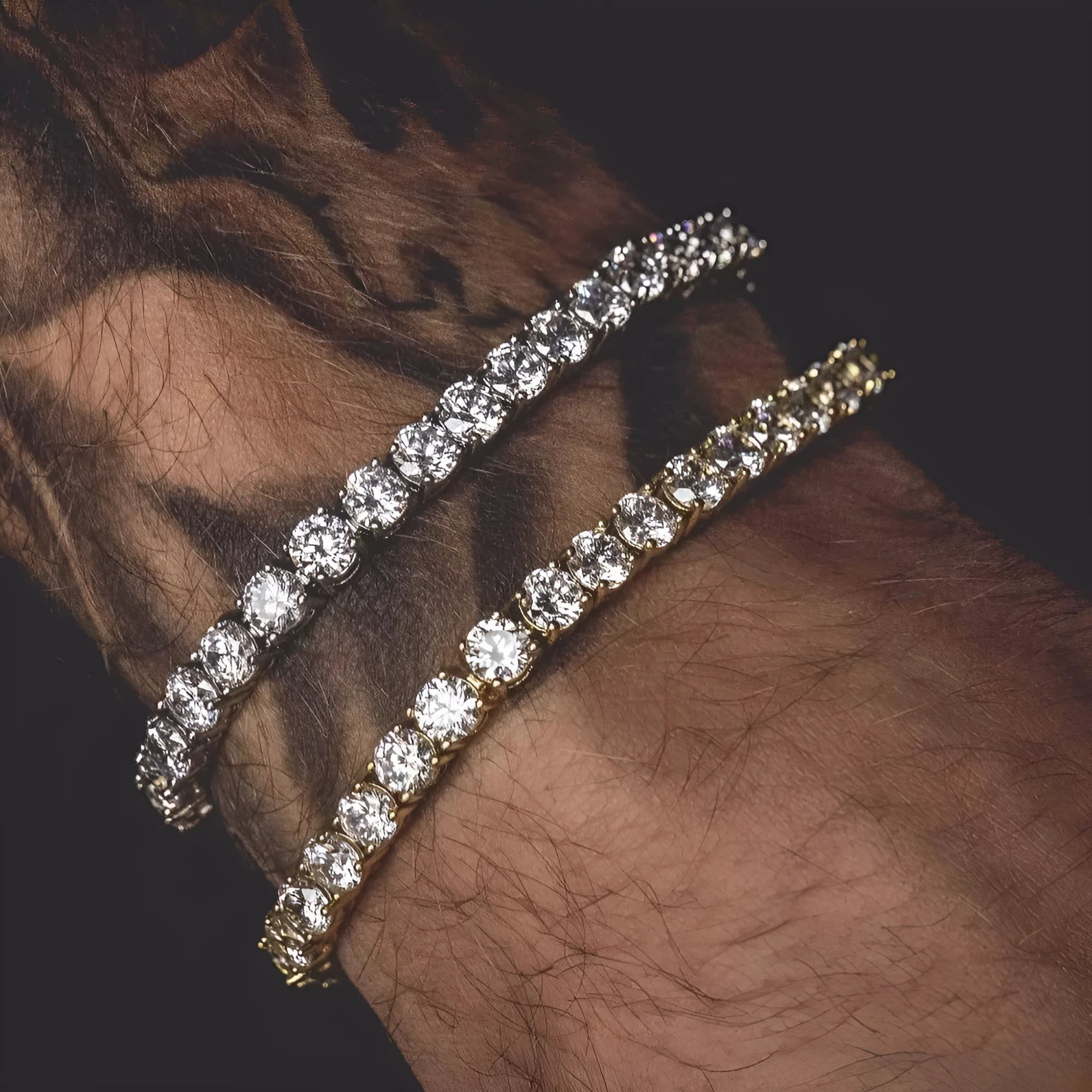 Men's silver geometric link bracelet with rows of clear rhinestones and a dangling tennis racket charm.
