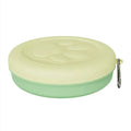 Collapsible portable silicone dog bowl shown in open and flat positions, available in green and pink colours.