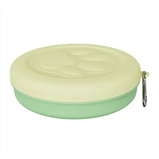 Collapsible portable silicone dog bowl shown in open and flat positions, available in green and pink colours.