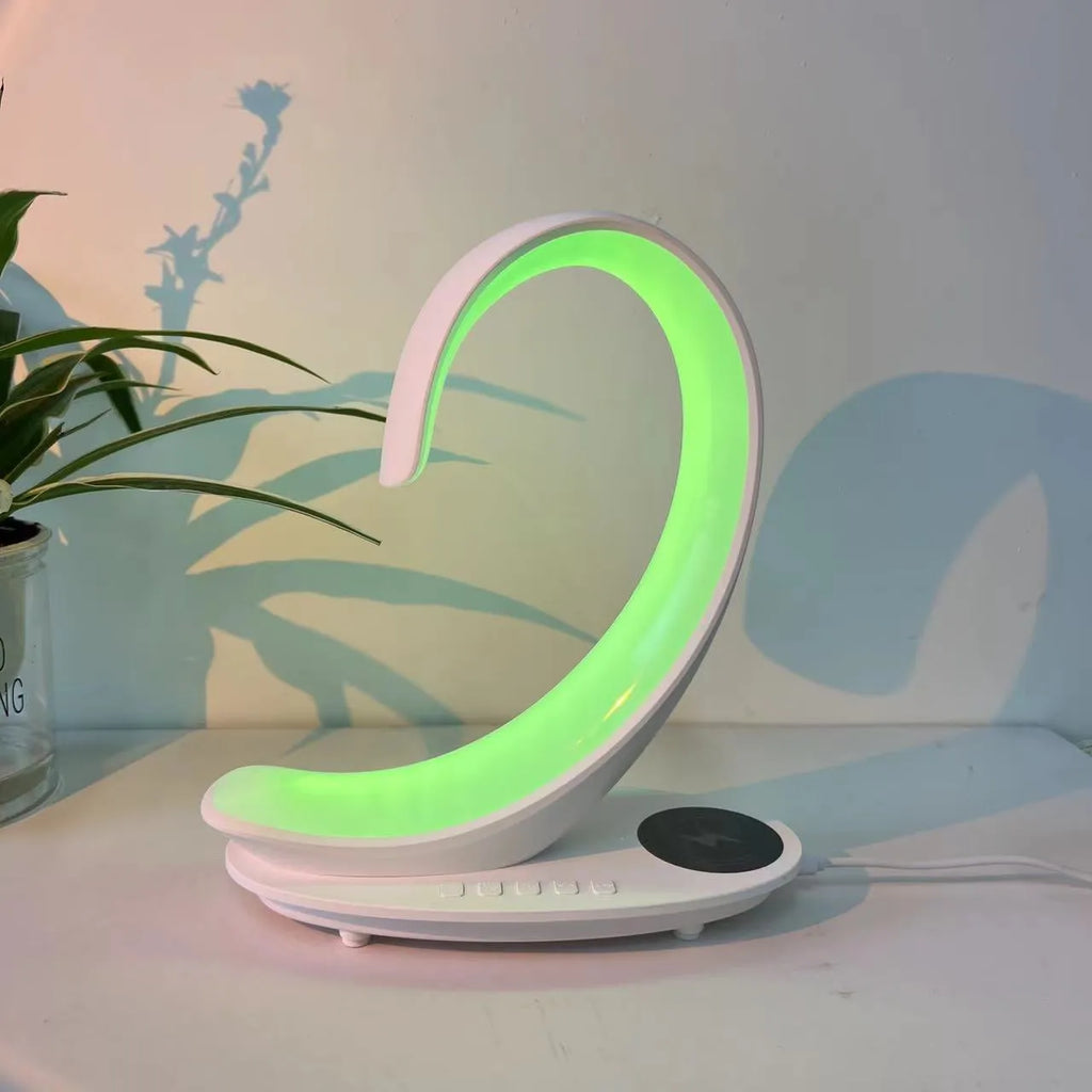 White swan shaped desktop wireless charger with Bluetooth speaker and colourful ambient lighting