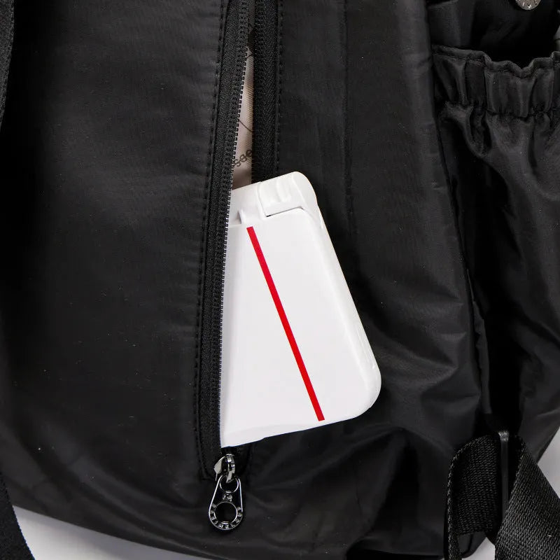 Women's outdoor backpack in black colour showing sandwich pocket design and large main compartment