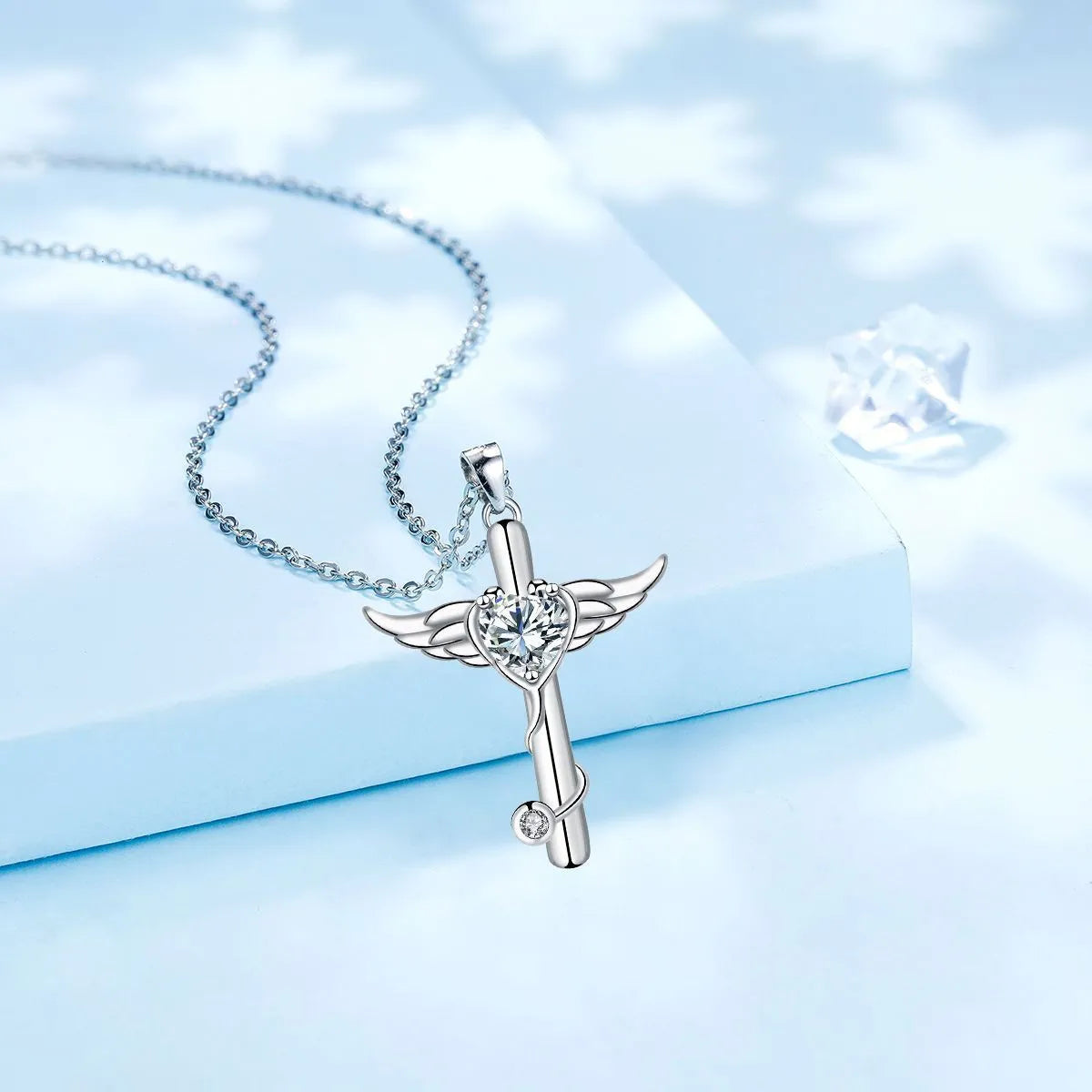 Wings cross stethoscope pendant necklace in copper with electroplated white or red diamond finish.