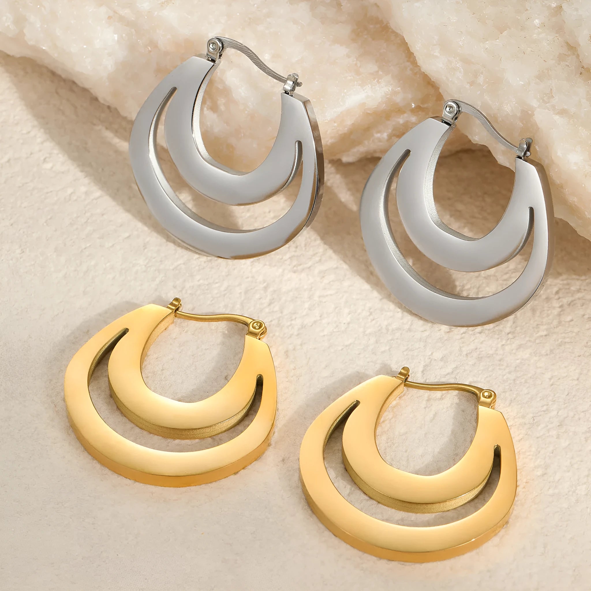 Geometric French earrings with 18K gold plating on stainless steel, featuring round ring elements in minimalist design