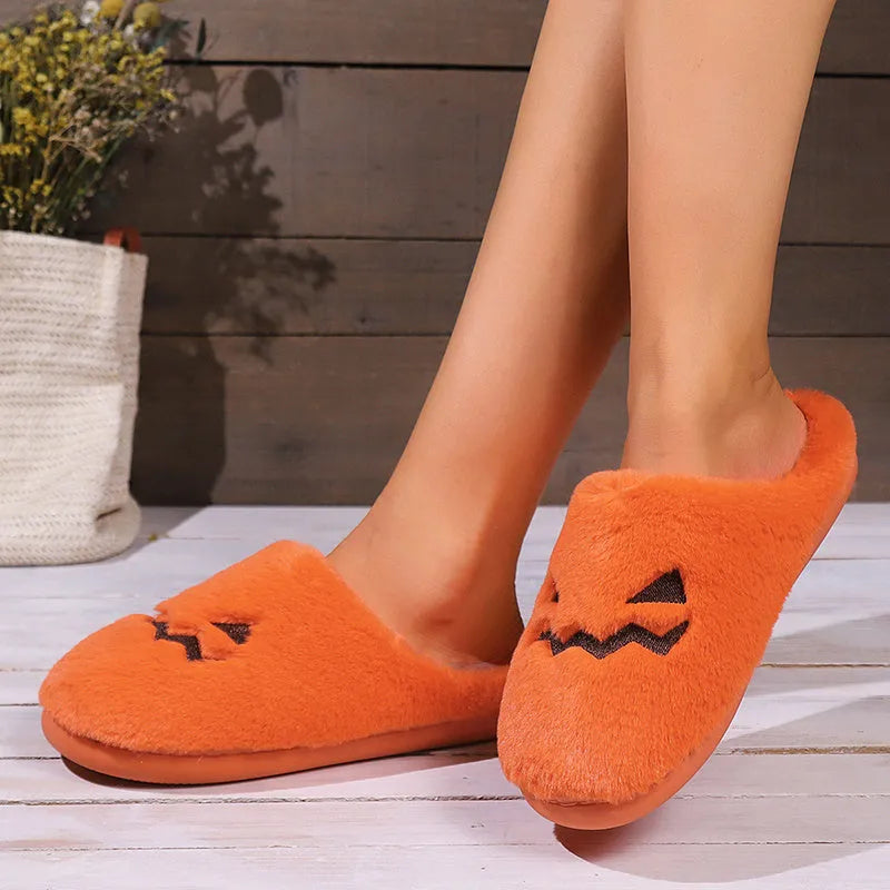 Orange Halloween pumpkin design plush slippers with coral velvet upper and flat PVC soles