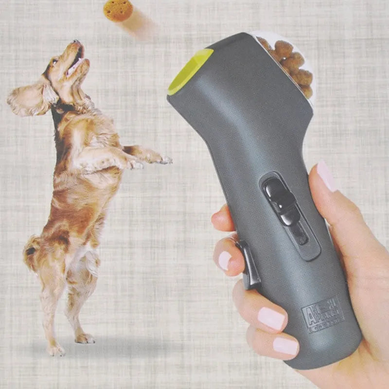 Grey plastic pet treat launcher measuring 18cm long with spring trigger for dog and cat training