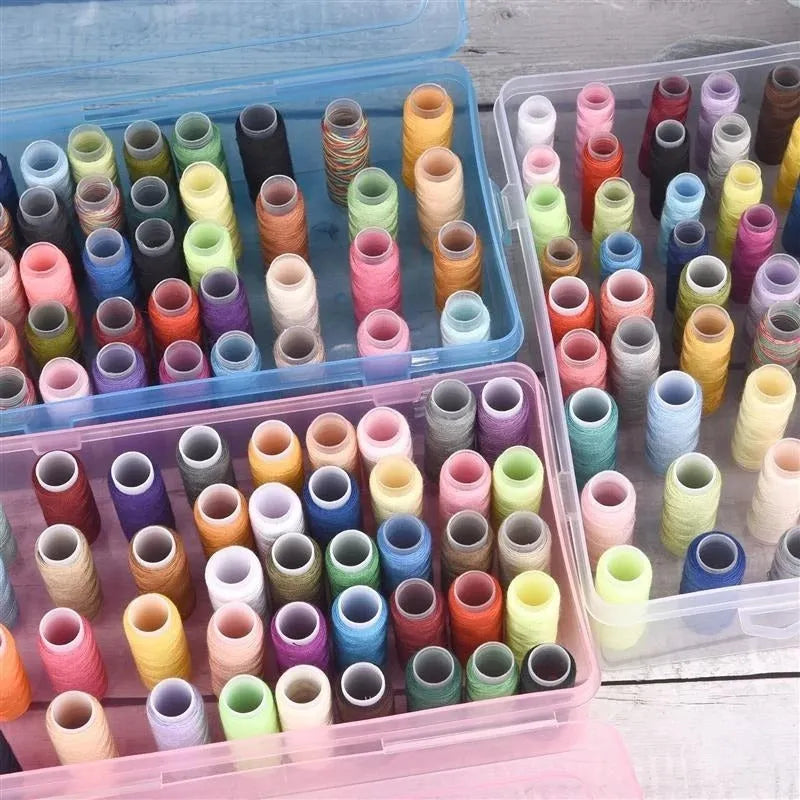 Transparent plastic storage box with 42 compartments for organising embroidery threads and sewing accessories.