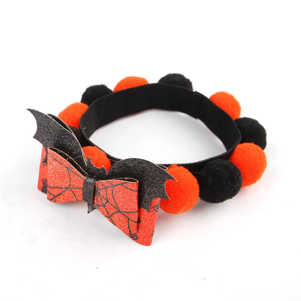 Halloween pet fur ball collar in pumpkin orange colour with fluffy ball on a black collar