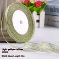 Roll of 0.6cm wide coloured polyester gift ribbon showing multiple colour options including metallic and fluorescent.