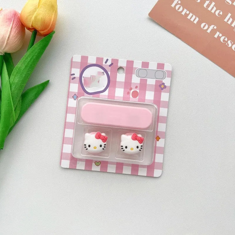 Colourful cartoon character plastic clip holding a magnetic charging cable on a desktop