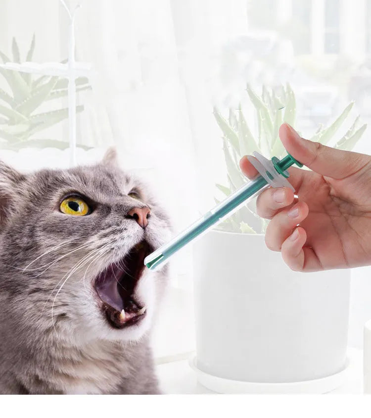 Two silicone pet pill shooters with soft tips for administering medication to cats and dogs