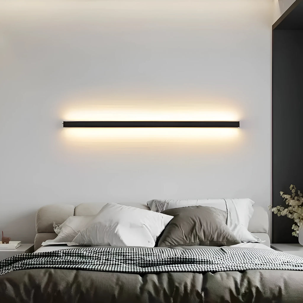 80 cm long black aluminium LED wall lamp with touch control for three light colours on a plain wall