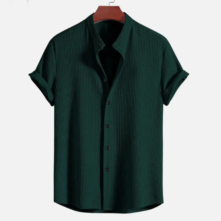 Men's loose short sleeve shirt in polyester available in multiple colours including wine red and dark green.