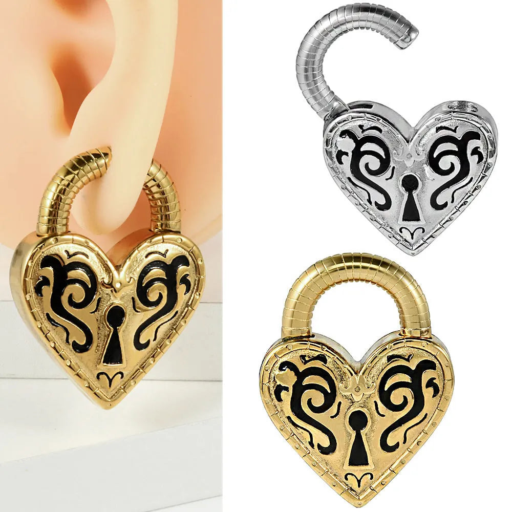 Heart-shaped stainless steel earring in steel colour close-up showing electroplated finish.