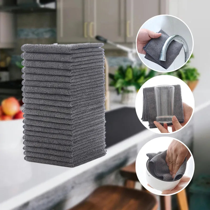 Grey square microfiber kitchen cleaning cloth for oil and grime on pots and bowls.