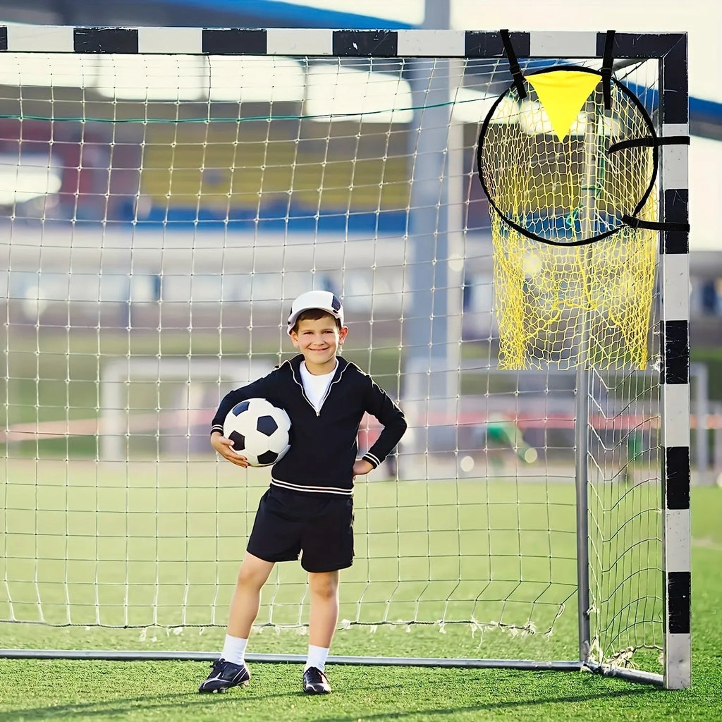 Portable soccer training goal net in black, used for practice shooting drills on grass