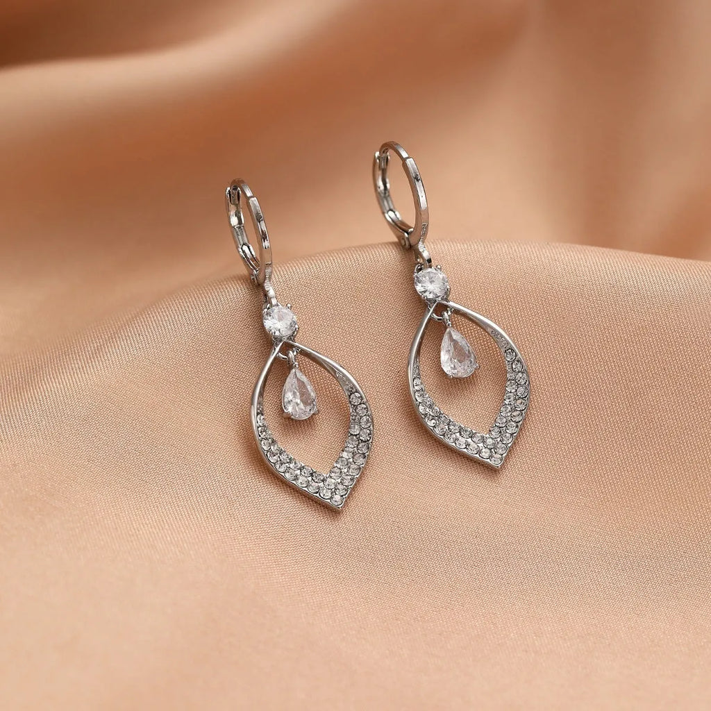 Gold and silver women's drop tassel earrings with zircon detail on a water drop shape.
