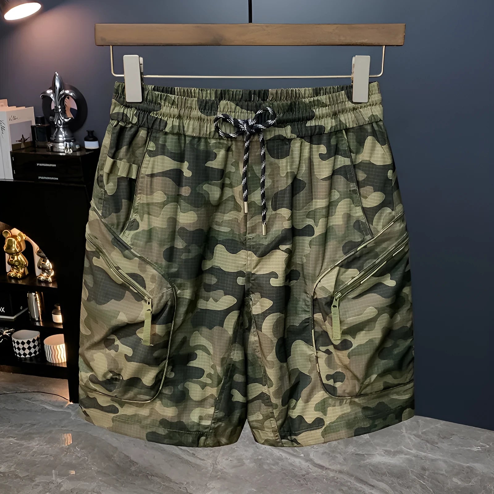 Man wearing loose-fit camouflage cargo shorts made from a cotton blend fabric.