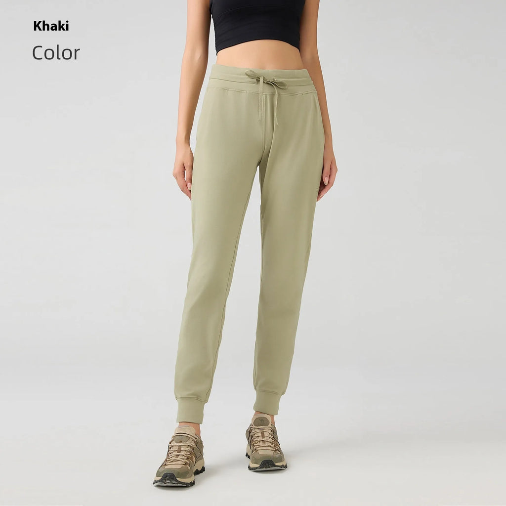 Women's high-waist yoga pants with drawstring waistband in quick-drying cotton blend fabric