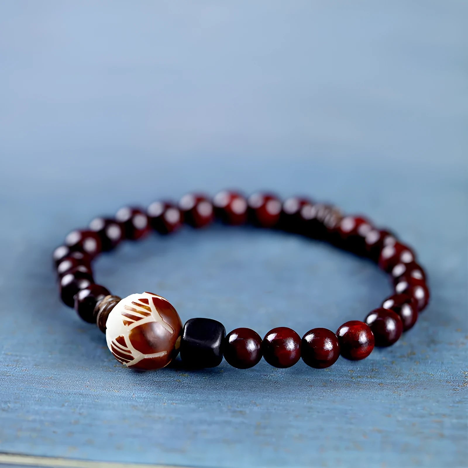 Natural rosewood knitted unisex bracelet with 10mm flower-shaped beads double circle on white background