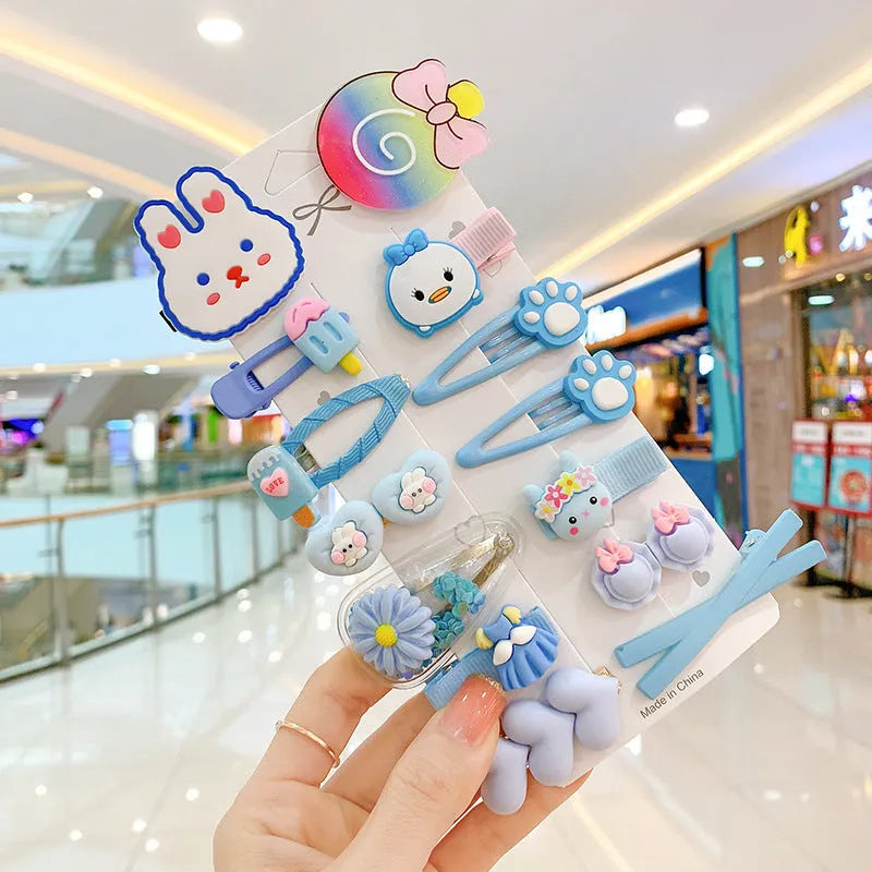 14-piece toddler hair accessories set: colourful rainbow, fruit, and butterfly barrettes in soft silicone clay.