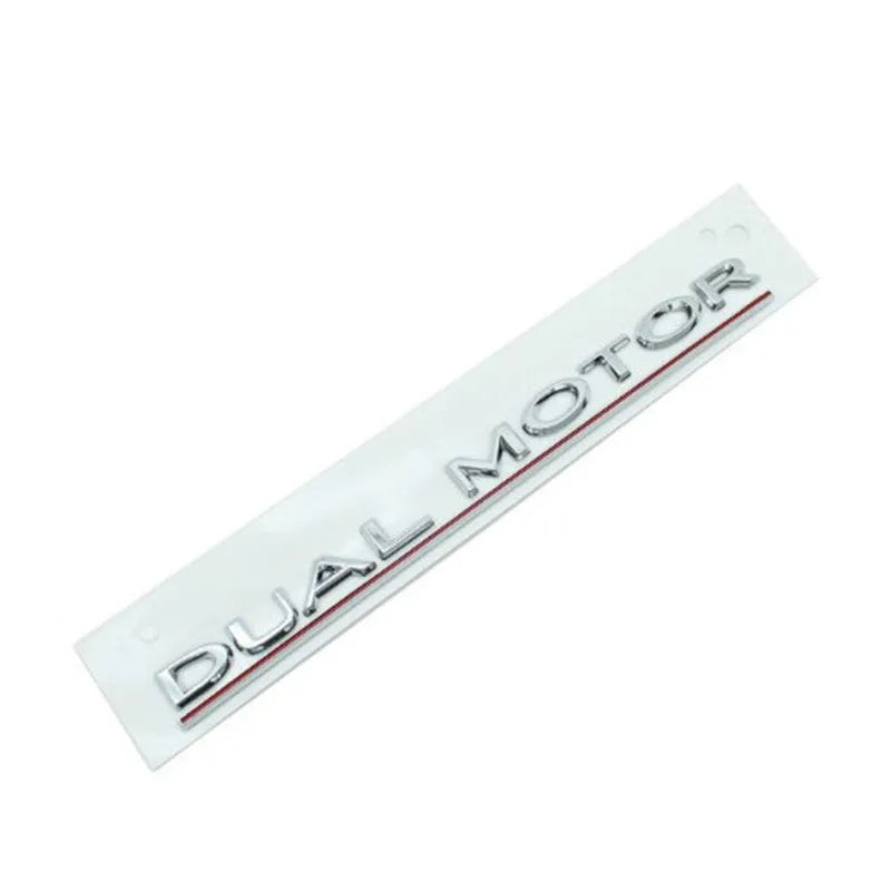 Tesla Model 3 Dual Motor bumper sticker in ABS plastic, shows matte black and silver colour options.