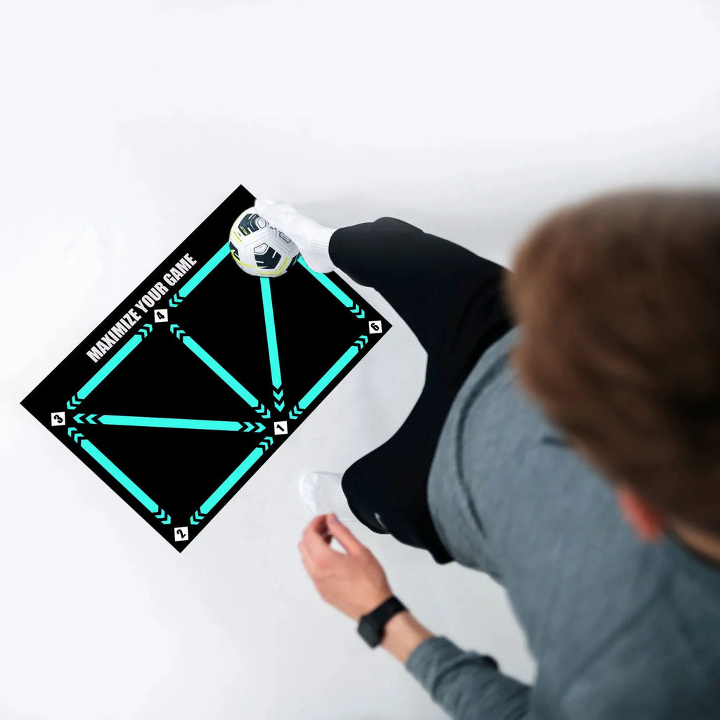 Black rectangular foam football training mat on a flat surface.