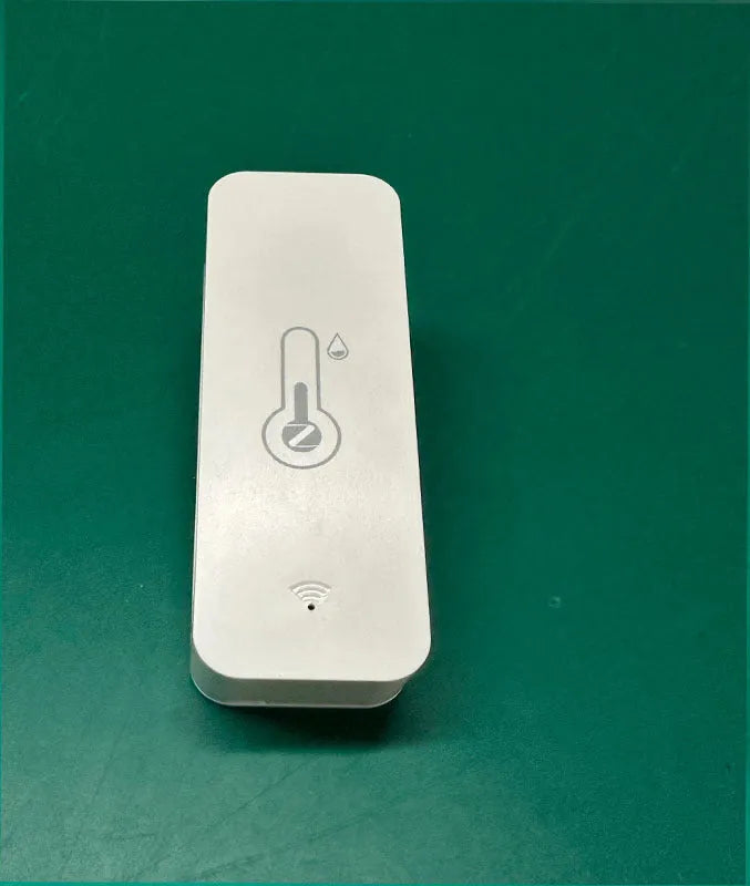 WiFi Zigbee temperature and humidity sensor in white ABS plastic casing showing digital display