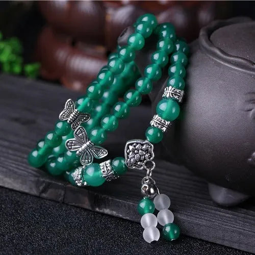 Natural green agate chain multi-layer bracelet with 6mm beads on a woman's wrist